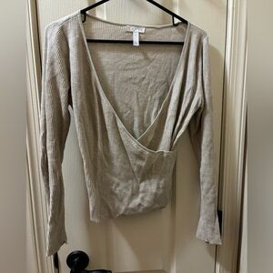 beige cross sweater